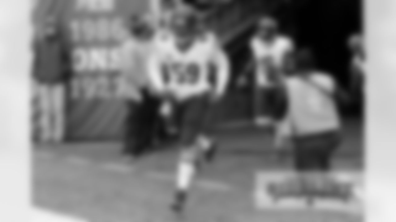 LB Danny Trevathan (59) and WR Eddie Royal (19).