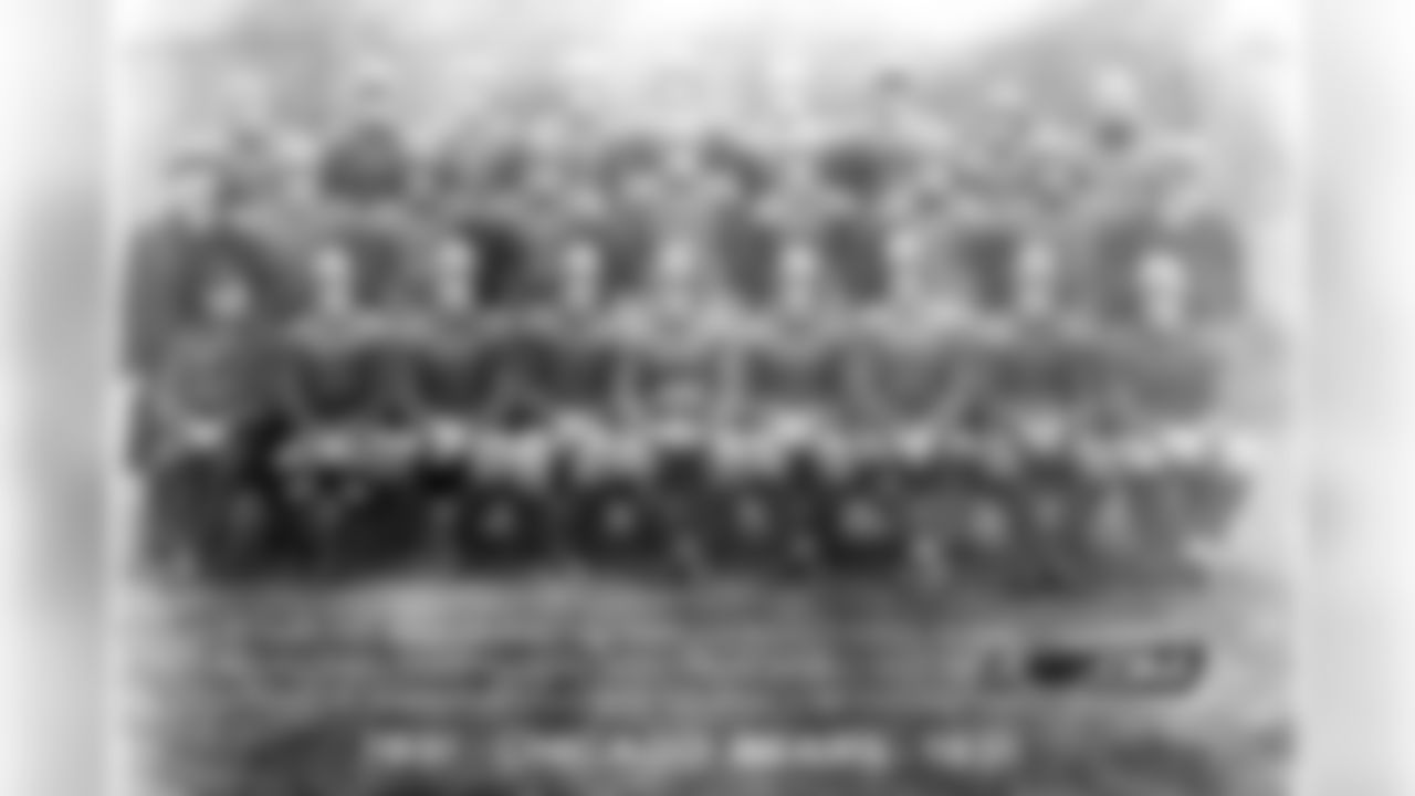 Nesbitt 3. Nagurski 4. Molesworth 5. Walquist 7. Lintzenich 8. Brumbaugh 9. Franklin 12. Lyman 13. Trafton 14. Burdick 16. Buckler 18. Murray 19. Tackwell 20. Carlson 21. McMullen 22. Schuette 23. Drury 24. Johnsos 25. Grange 26. Pearson 33. Joesting 54. Hibbs 77. Grange George Halas - President, Ralph Jones - Head Coach