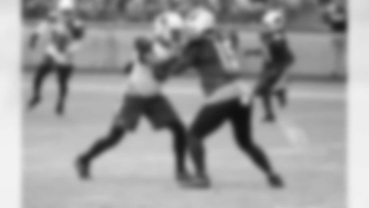S Budda Baker and WR Jeremy Ross lock up