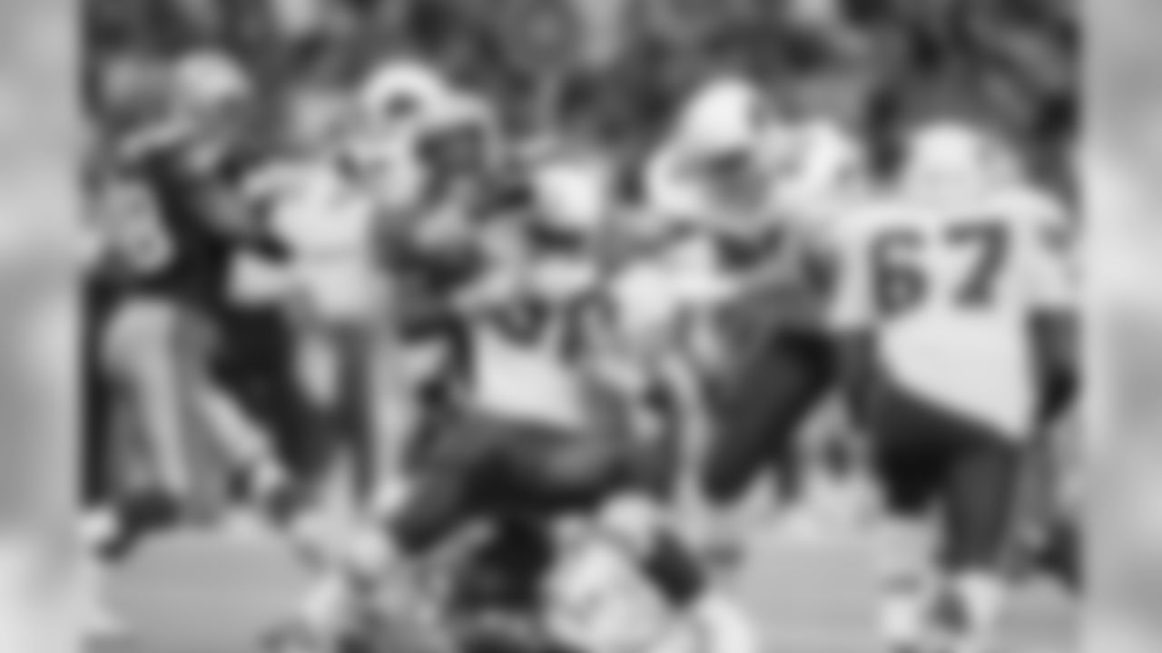 1993: RB Ron Moore is wrapped up by Seahawks DL Cortez Kennedy