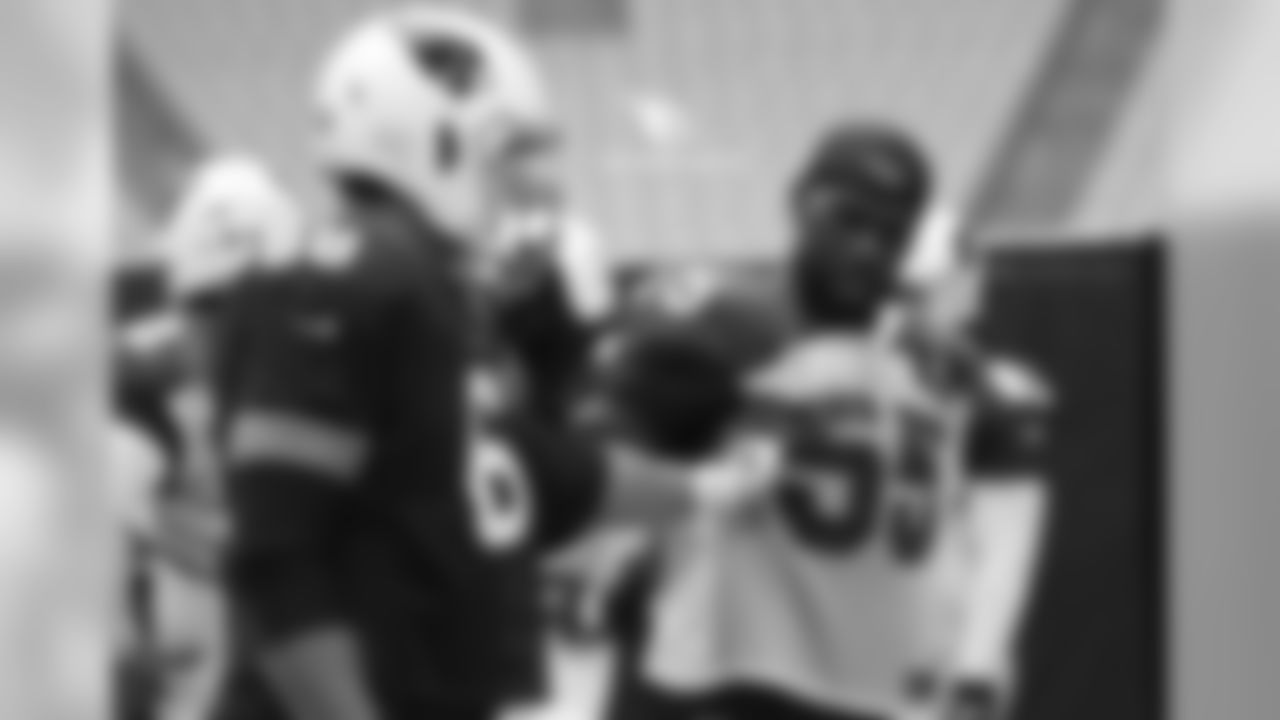 T Jared Veldheer (left) and LB Chandler Jones discuss pass-blocking