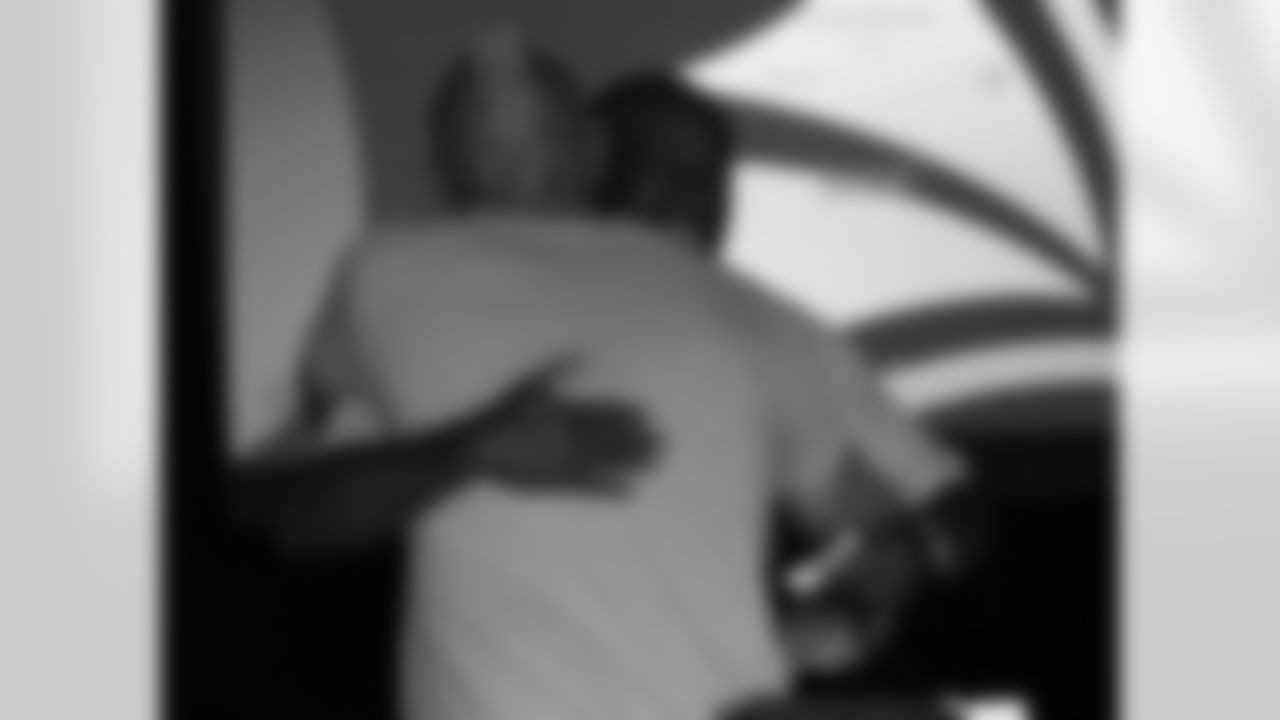 Roy Green hugs Johnny Johnson