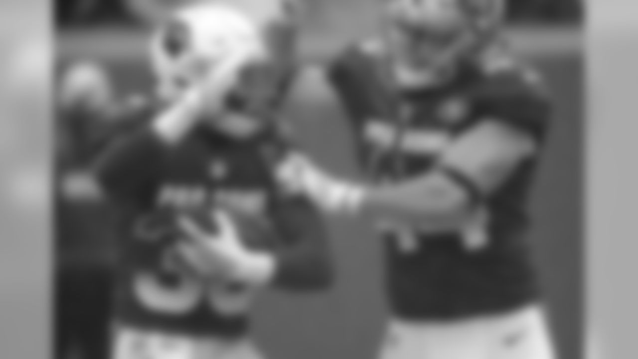 S Budda Baker is congratulated by 49ers fullback Kyle Juszczyk after recovering a muffed punt
