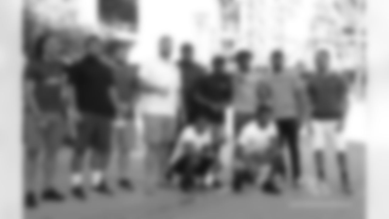 In front of Chase Field (in back, from left): Krishawn Hogan, Pasoni Tasini, Lucas Crowley, Will Holden, Jonathan McLaughlin, Gump Hayes, Chad Williams, Haason Reddick, Ryan Lewis. (In front) Sojourn Shelton, Rudy Ford