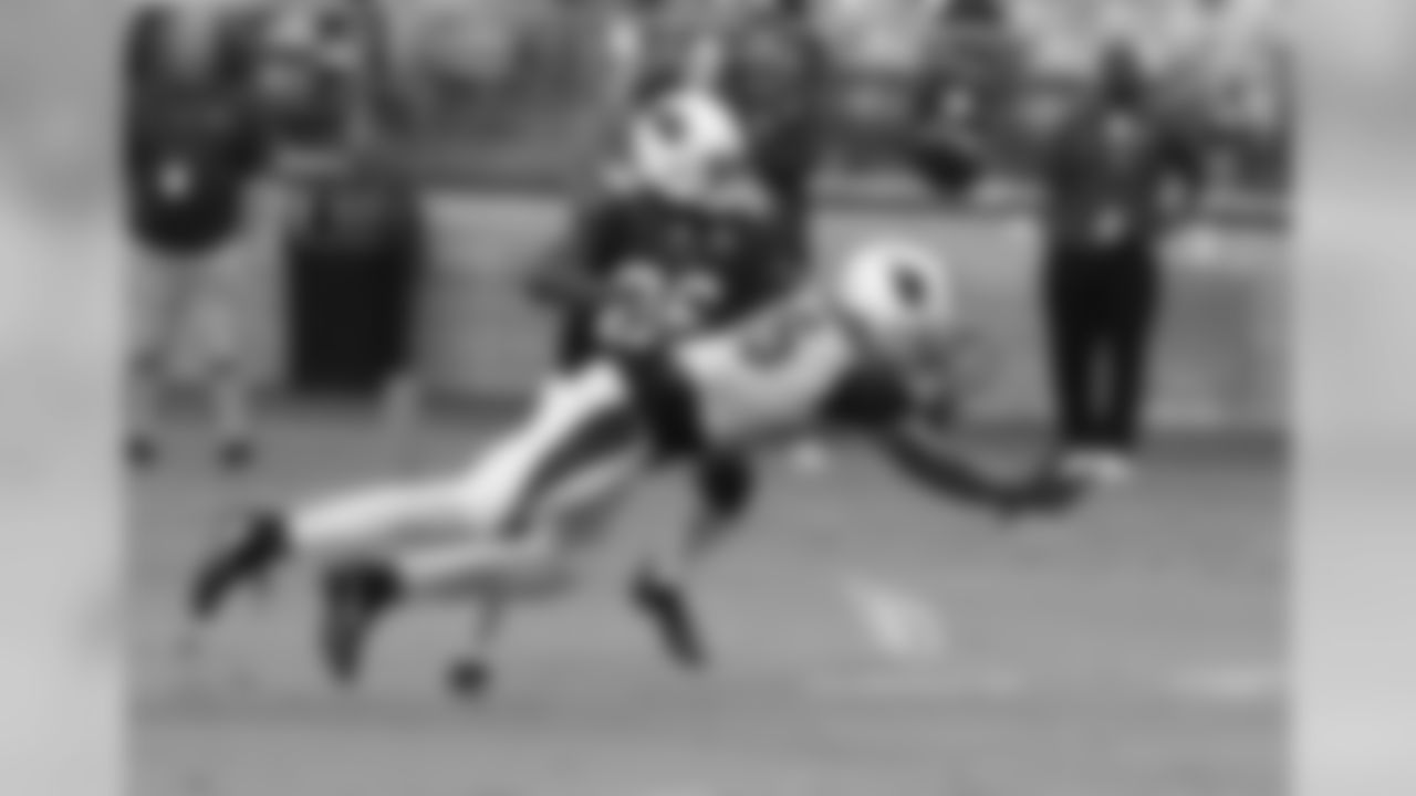 CB Brandon Williams is about to grab a tipped ball for an interception from WR Michael Floyd