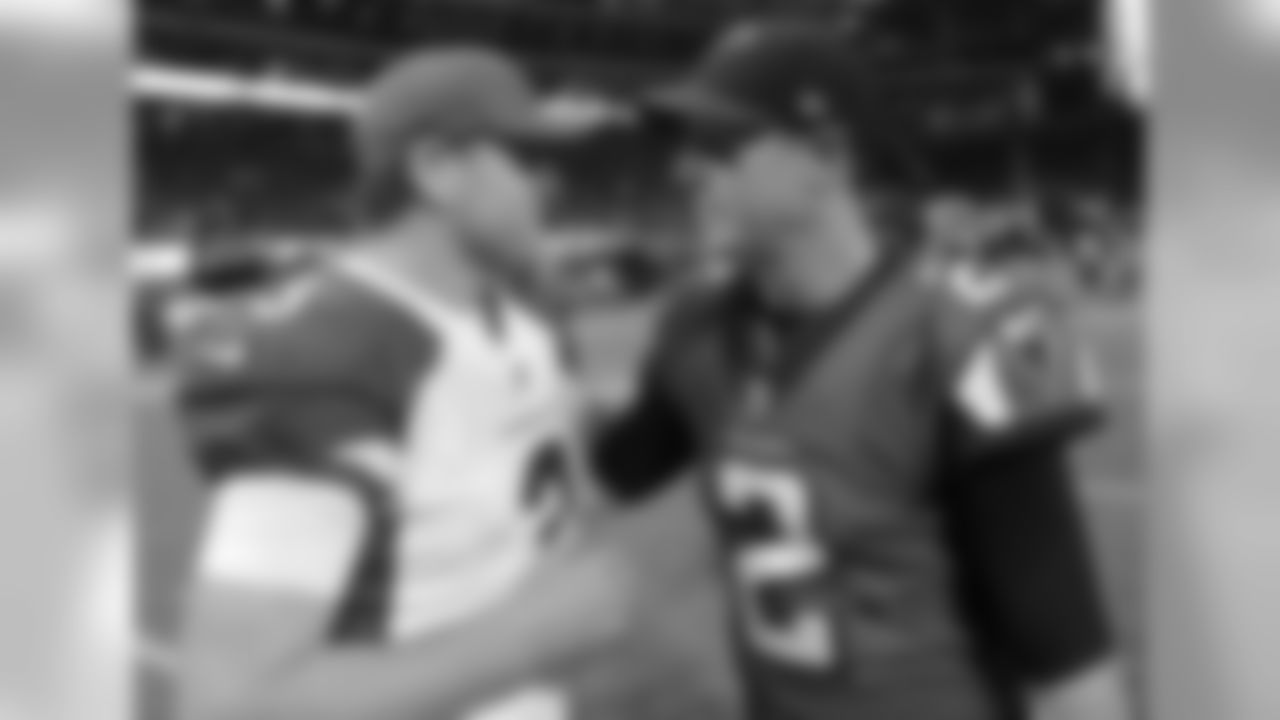 Cardinals QB Carson Palmer meets up with Falcons QB Matt Ryan after the game