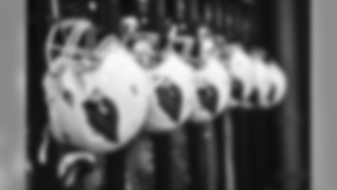 A row of Cardinals helmets