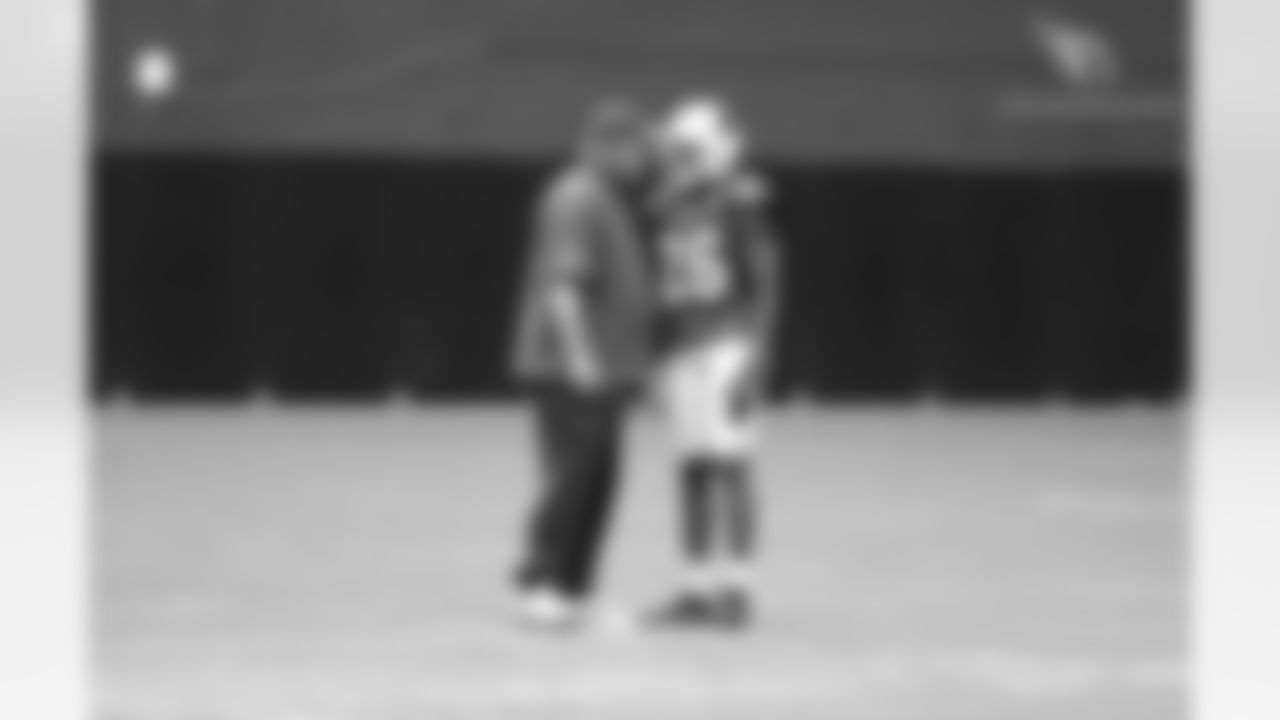 Coach Bruce Arians talks with CB Brandon Williams