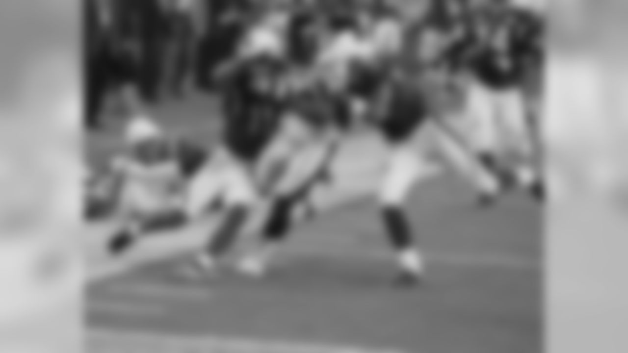 Fitzgerald and Steve Breaston can't pull down Steelers linebacker James Harrison on his 100-yard interception return during the Super Bowl