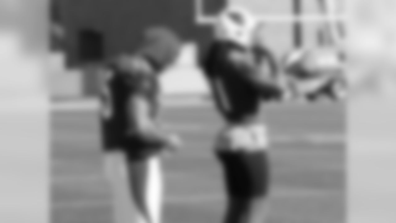 WR Michael Floyd (left) and WR Larry Fitzgerald preparing for practice