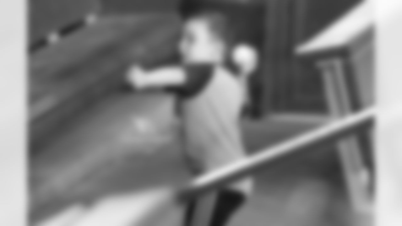 Steve Keim's son, Brady, throws a whiffle ball in the dugout
