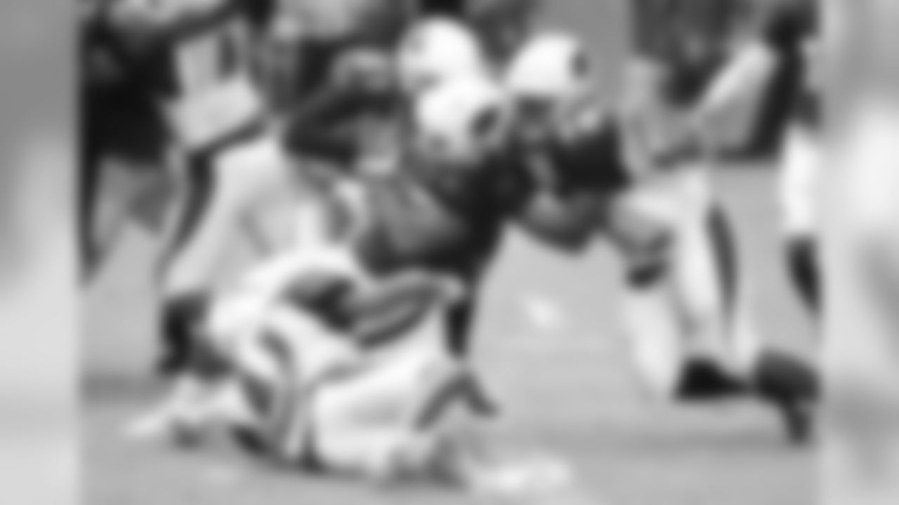 RB Elijhaa Penny pushes his way into the end zone