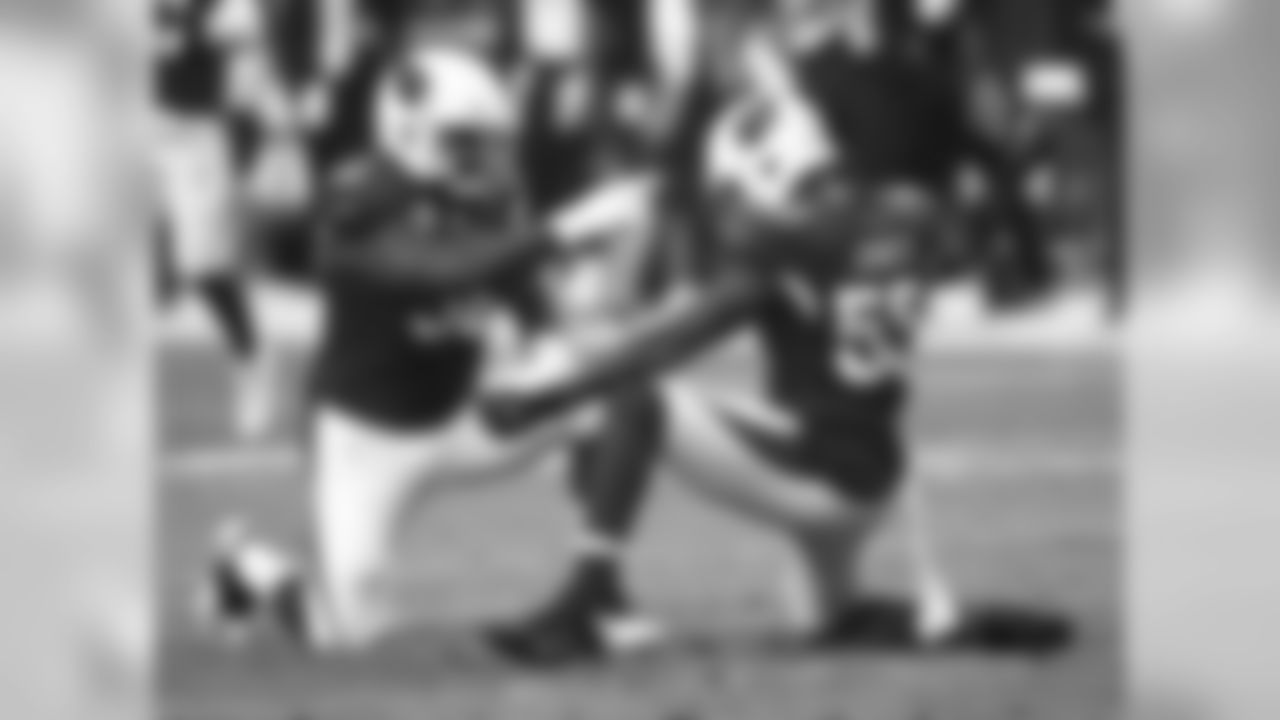 Chandler Jones (right) celebrates a stop with DL Frostee Rucker (left)