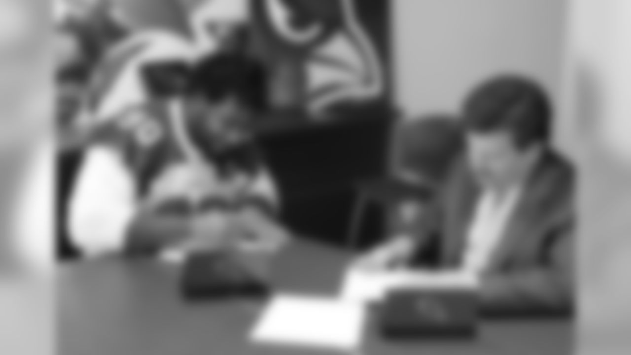 DT Robert Nkemdiche signs his contract with team president Michael Bidwill