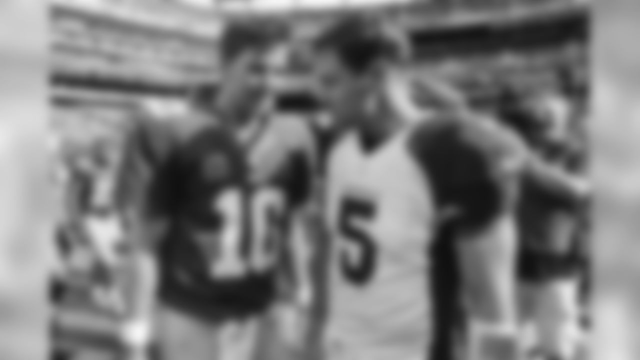 2014: Giants QB Eli Manning (left) with Cardinal QB Drew Stanton
