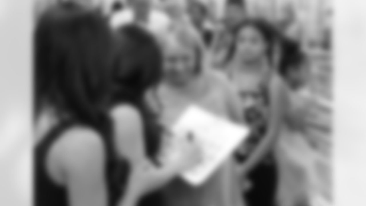 The Cardinals cheerleaders signing autographs