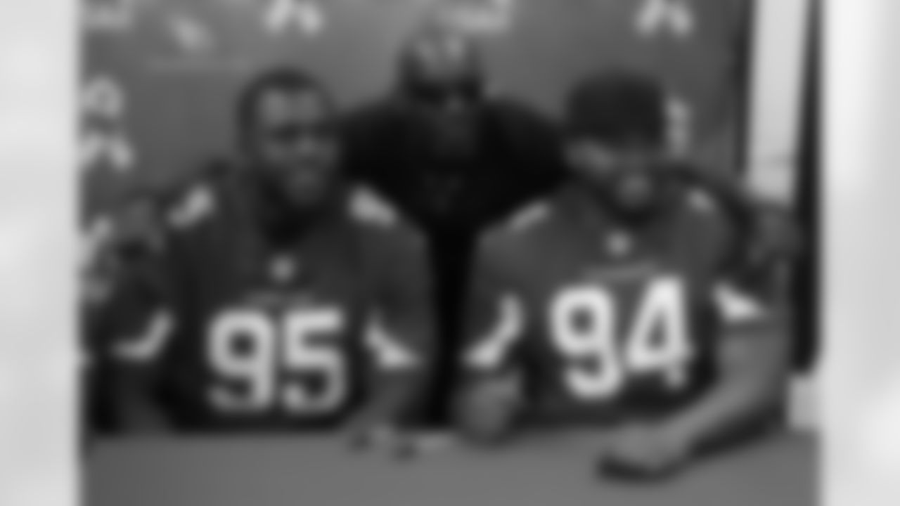 DT Rodney Gunter (left) and DT Xavier Williams pose with a fan
