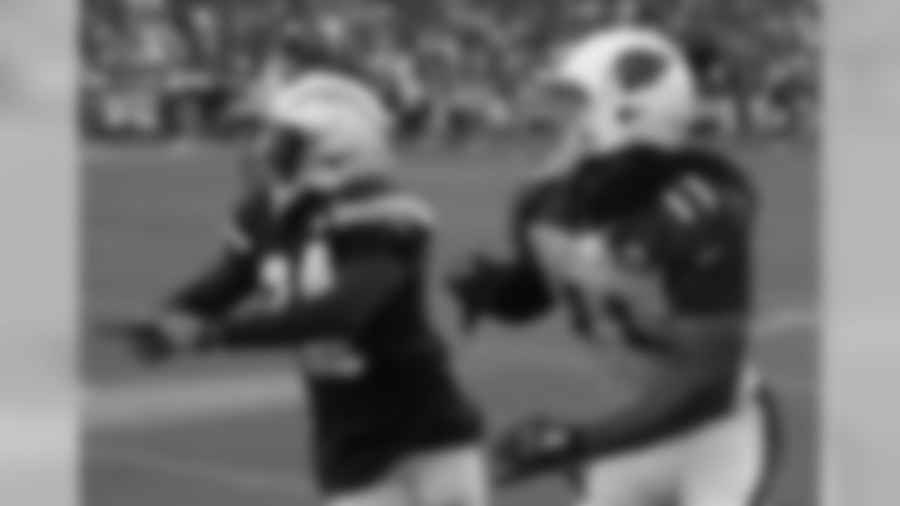 WR Larry Fitzgerald (right) and Chargers CB Brandon Flowers look for a pass