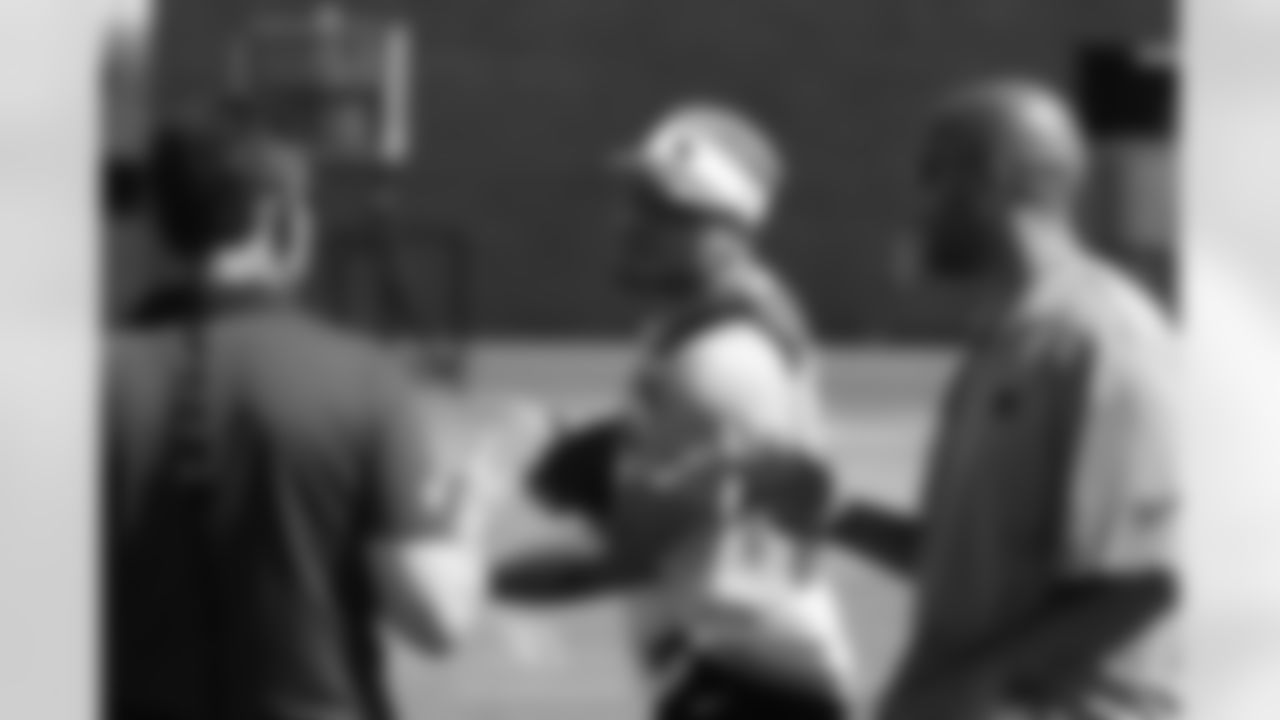 "Coach" Tyrann Mathieu talks with fellow coaches Nick Rapone and Larry Foote