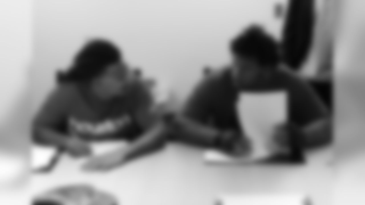 S Marqui Christian and DT Robert Nkemdiche fill out paperwork