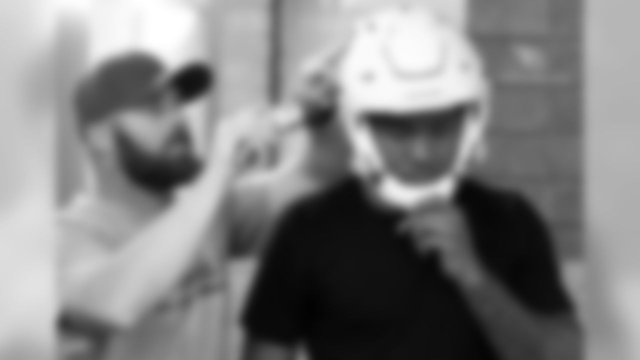 S Budda Baker getting his helmet fitted