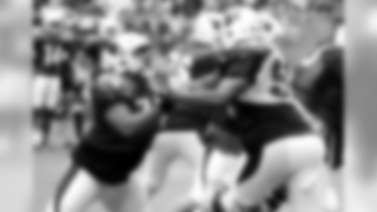 T D.J. Humphries (left) battles LB Chandler Jones