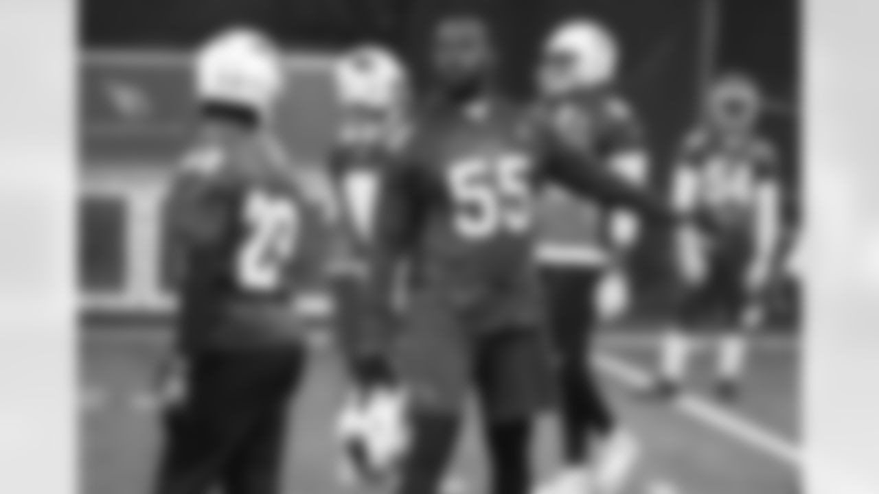 LB Chandler Jones (right) and CB Justin Bethel talk strategy
