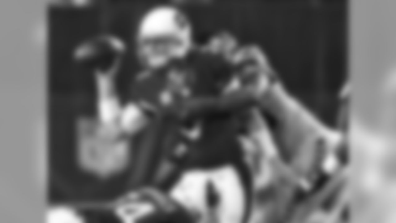 QB Carson Palmer manages to dump the ball off despite pressure
