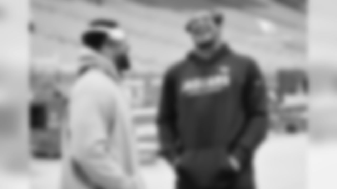 DL Corey Peters (left) catches up with former Cardinal Calais Campbell