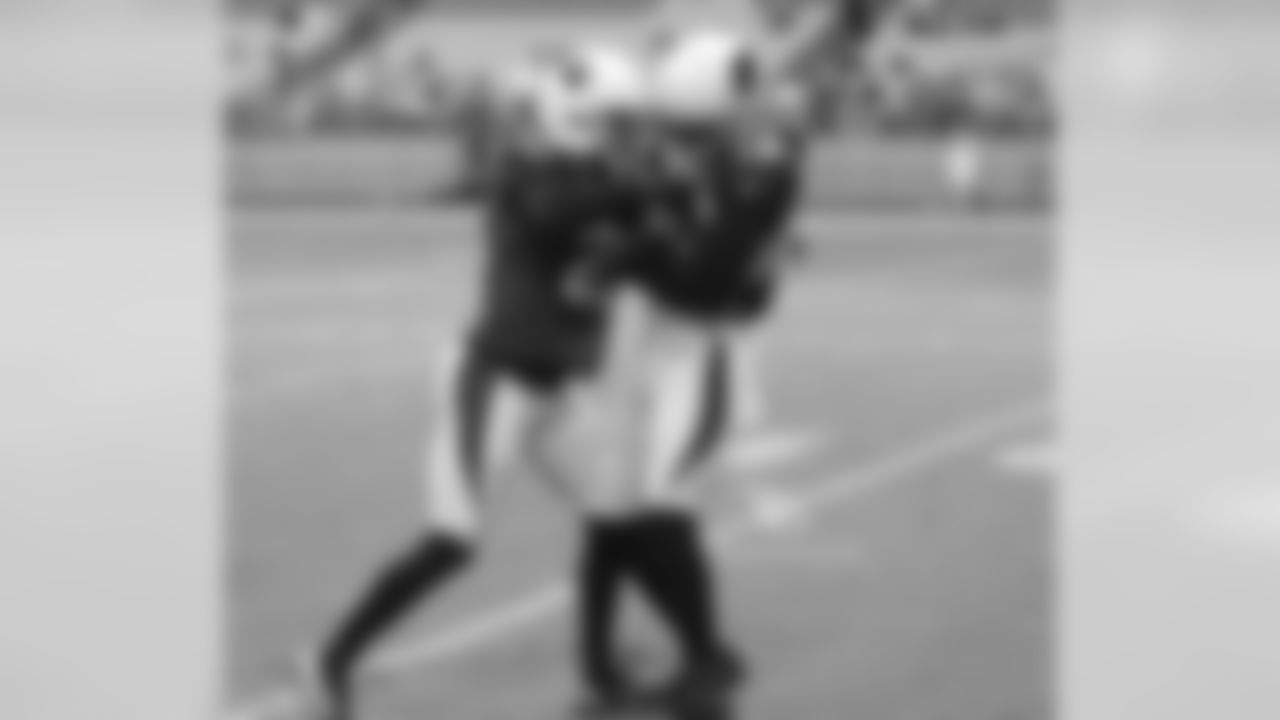 CB Justin Bethel and WR Jaron Brown battle for the ball