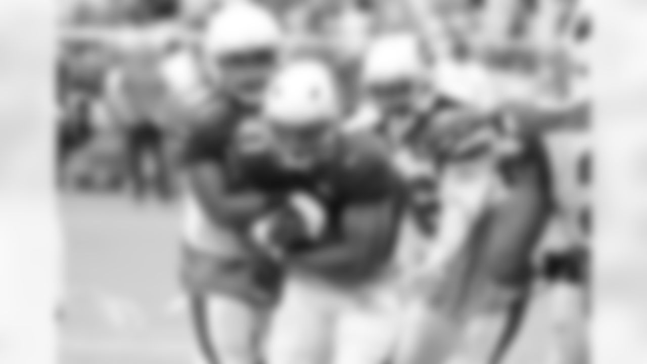 RB David Johnson is wrapped up by LB Kevin Minter