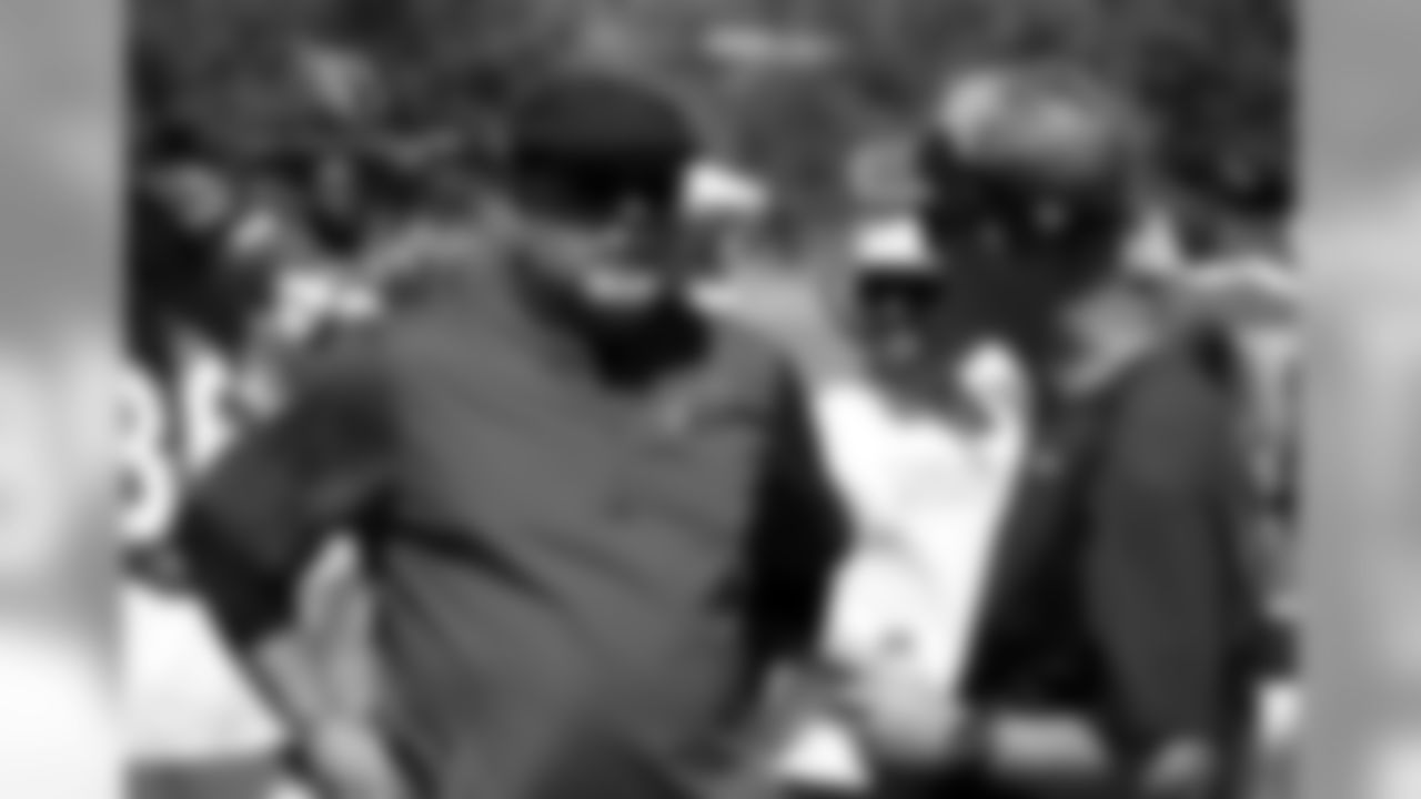 Bruce Arians chats with Chargers coach Mike McCoy
