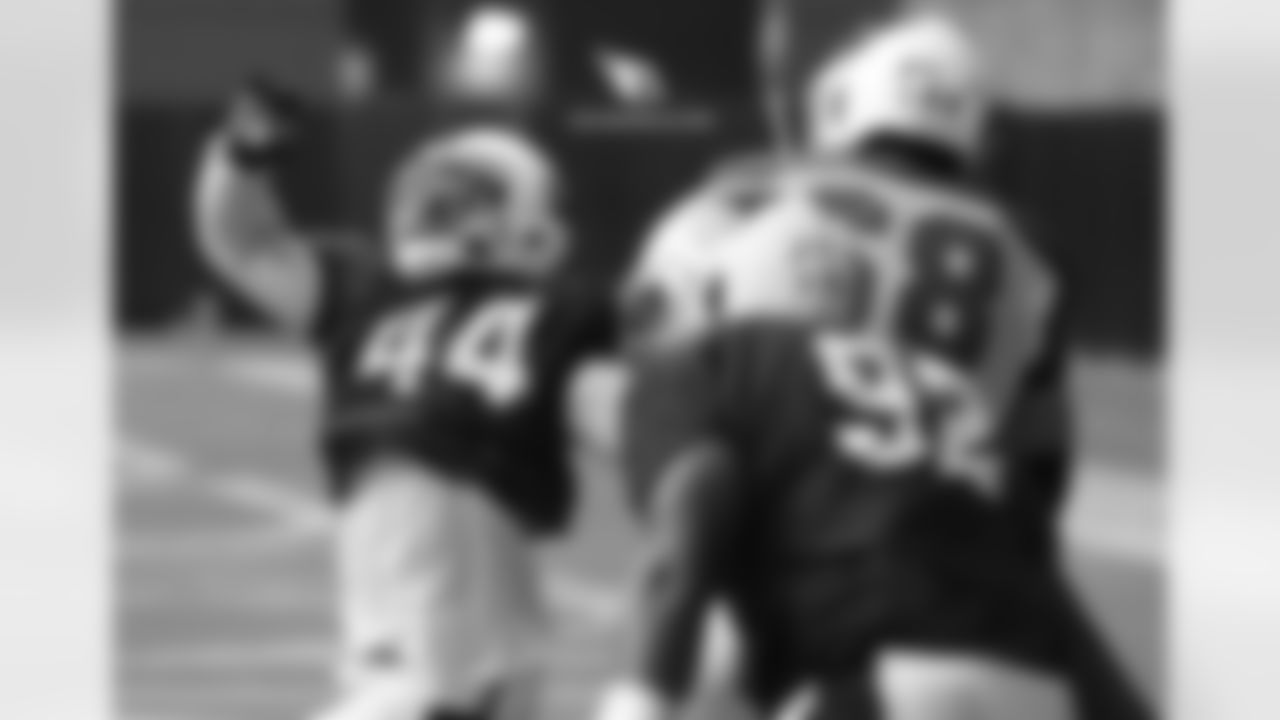 LB Markus Golden (left) goes against T Jared Veldheer in a pass-rush drill