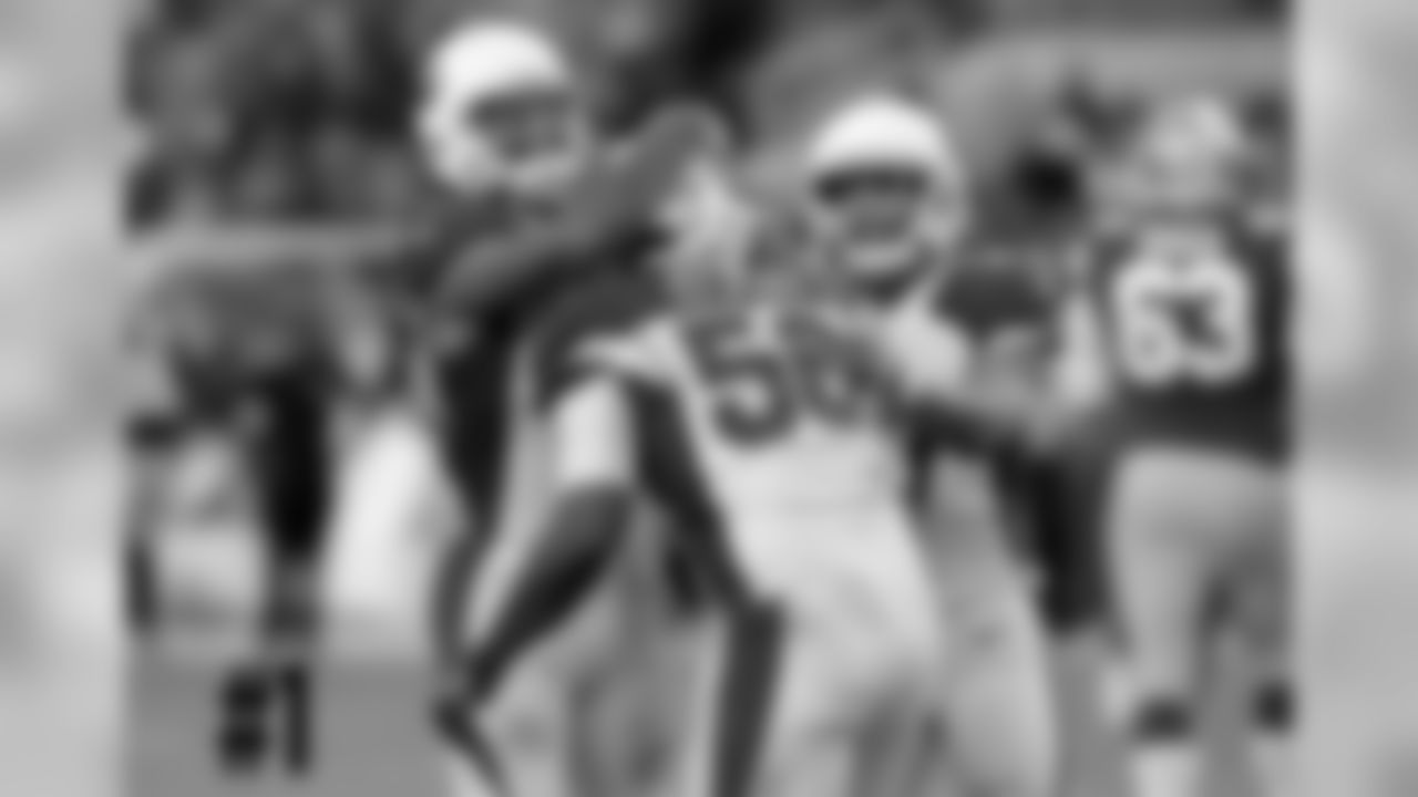 WR Larry Fitzgerald mugs LB Karlos Dansby after his game-sealing interception