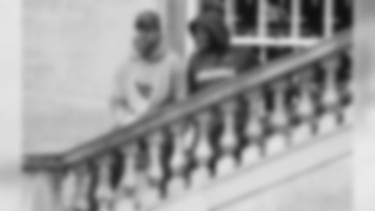 Carson Palme and Andre Ellington have a discussion on the castle steps