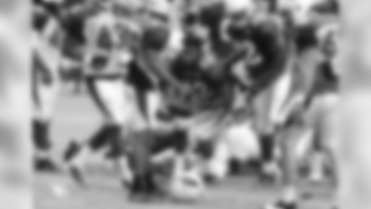 RB T.J. Logan loses his helmet