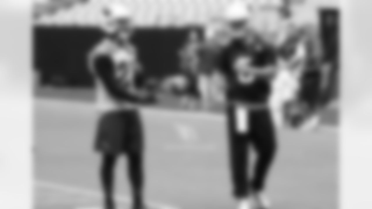 Patrick Peterson tosses the ball to Drew Stanton