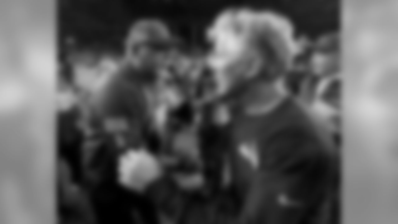 Cardinals head coach Bruce Arians (left) greets Seahawks head coach Pete Carroll (right) after the game