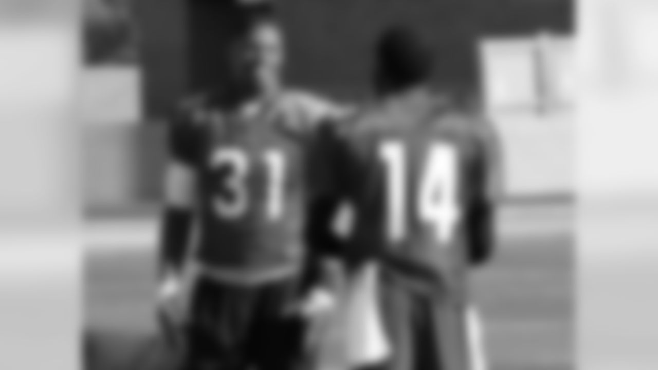 RB David Johnson (left) talks to WR J.J. Nelson