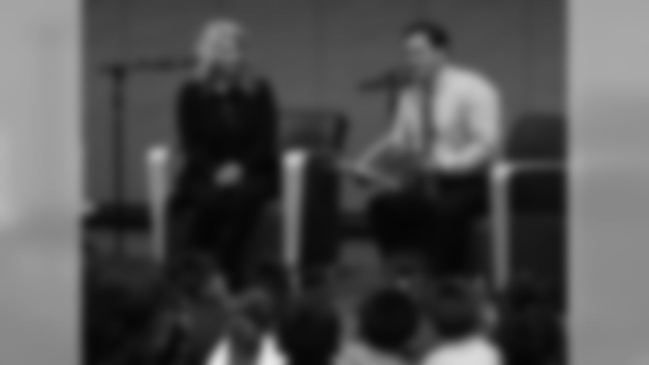 Governor Doug Ducey reads to the students as Nicole Bidwill looks on
