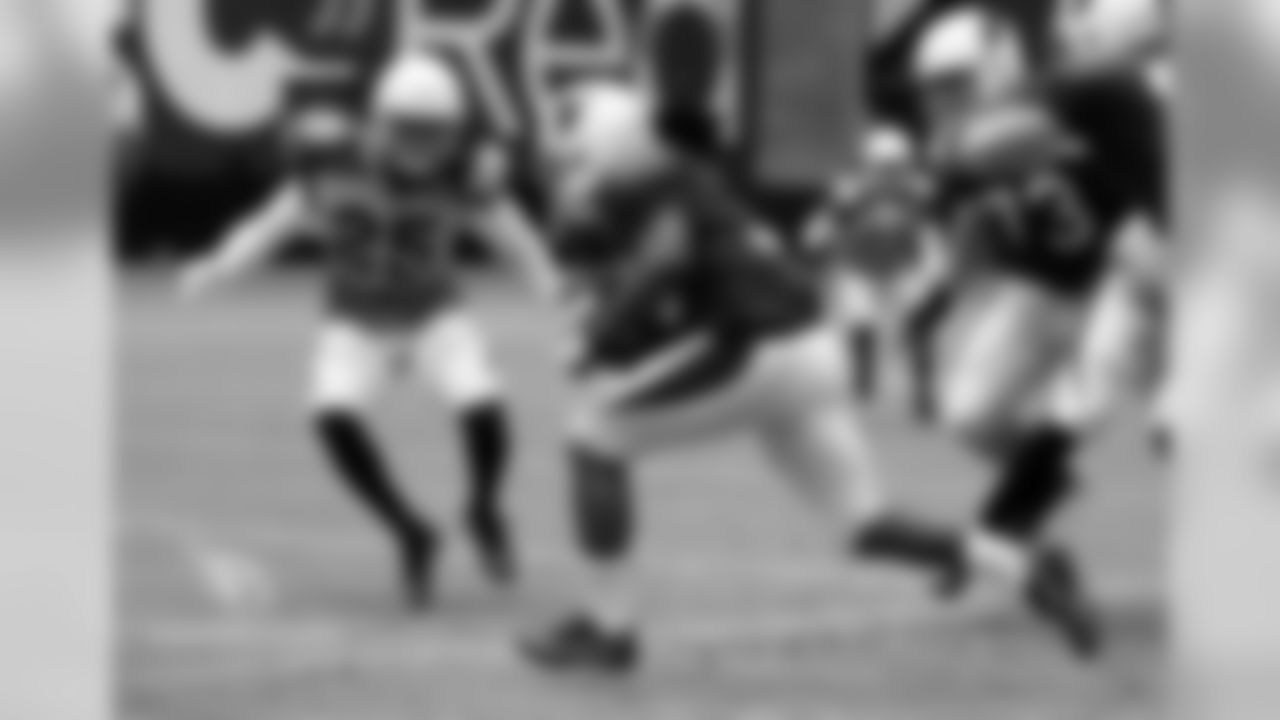 S Marqui Christian comes up to make the tackle