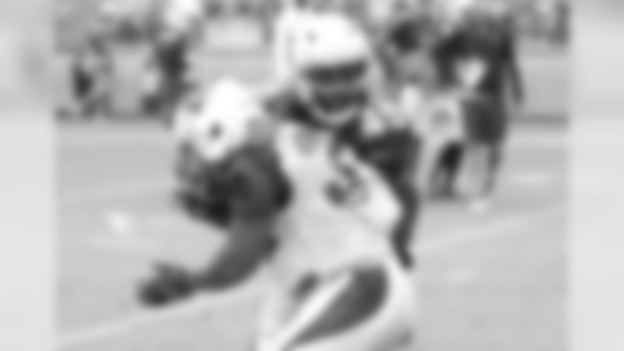 RB James Summers absorbs a hit from CB Jarell Carter