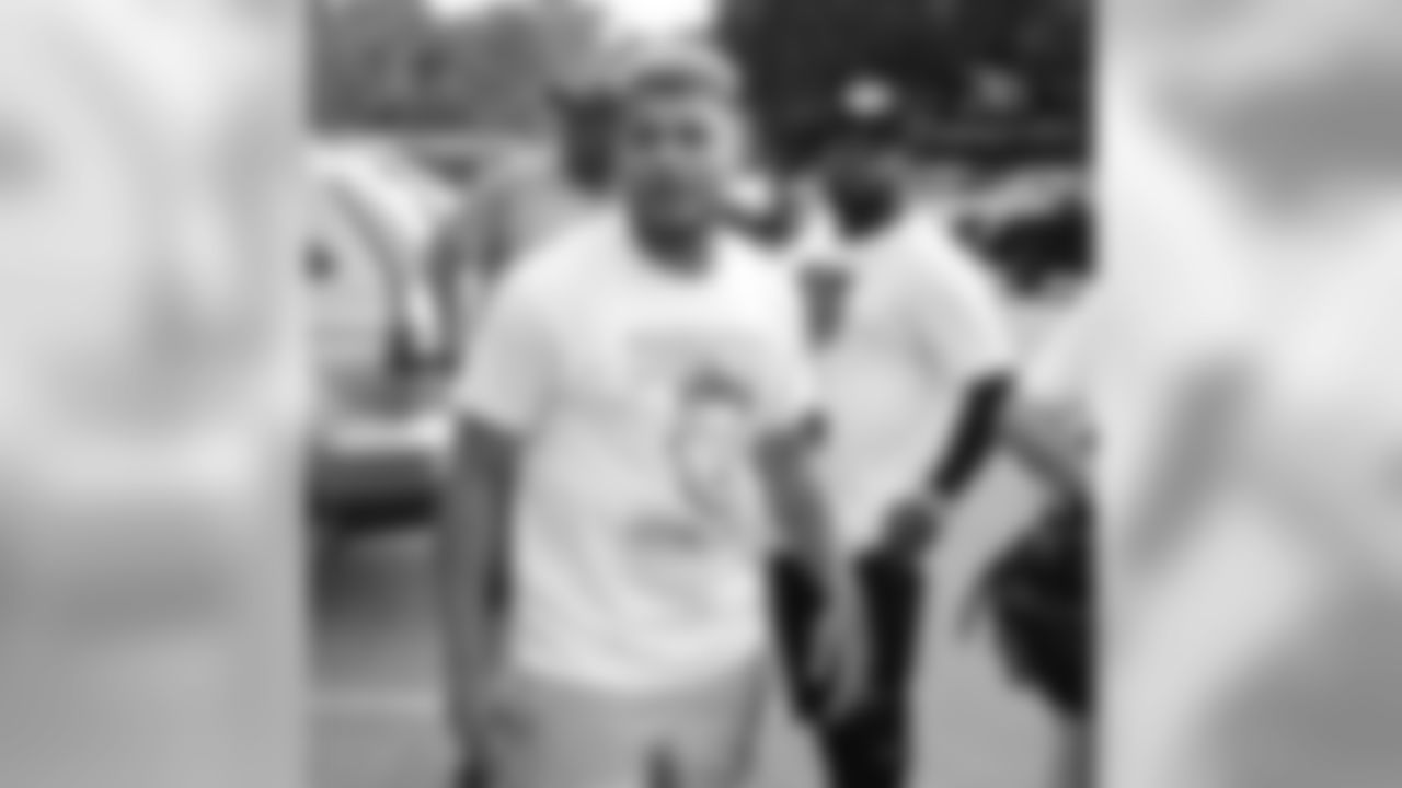 Mathieu before his camp, accompanied by brother Tyrone Mathieu Jr.