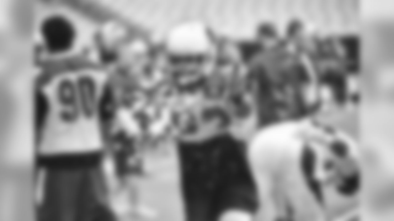 S Matthias Farley throws some spilled ice off the field