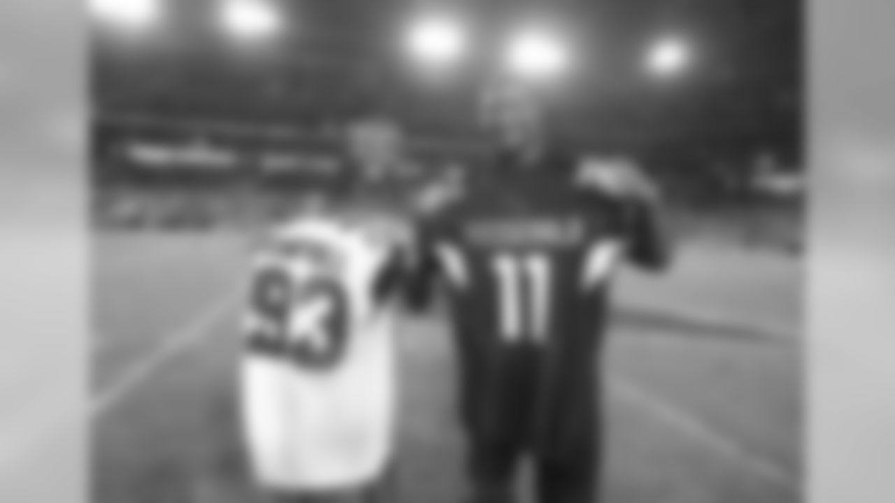 Larry Fitzgerald (left) and Calais Campbell (right) exchange jerseys after the game