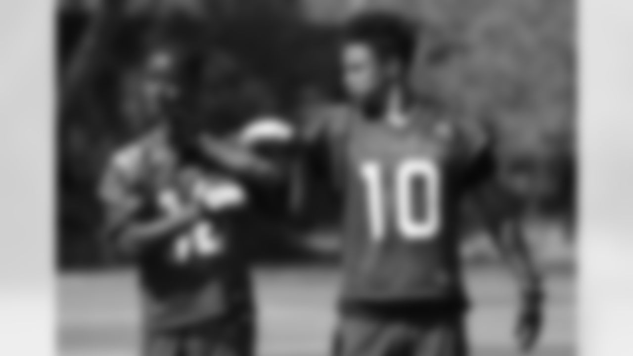 WR Brittan Golden gives WR John Brown a love tap