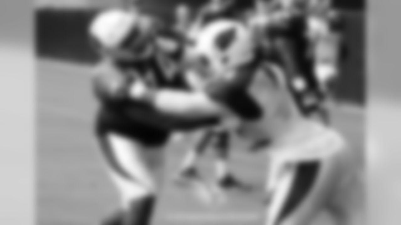 T D.J. Humphries (left) battles LB Markus Golden