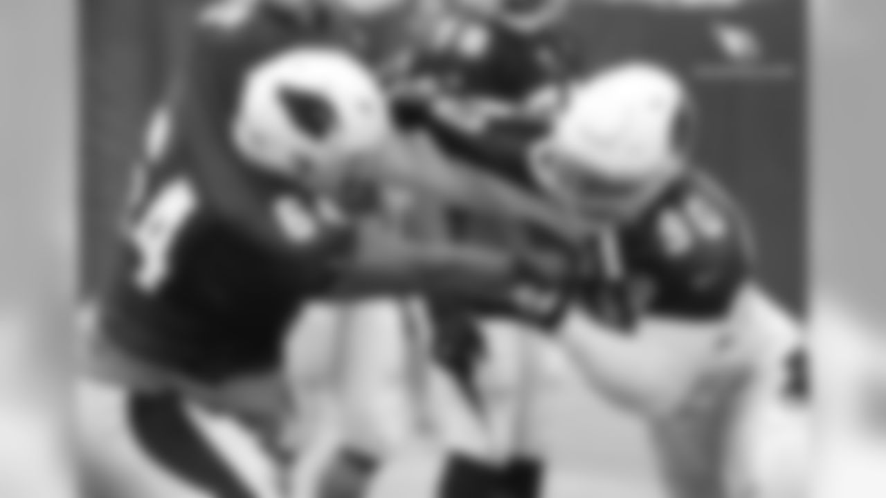 DT Robert Nkemdiche (right) battles G Dorian Johnson in a pass-rush drill