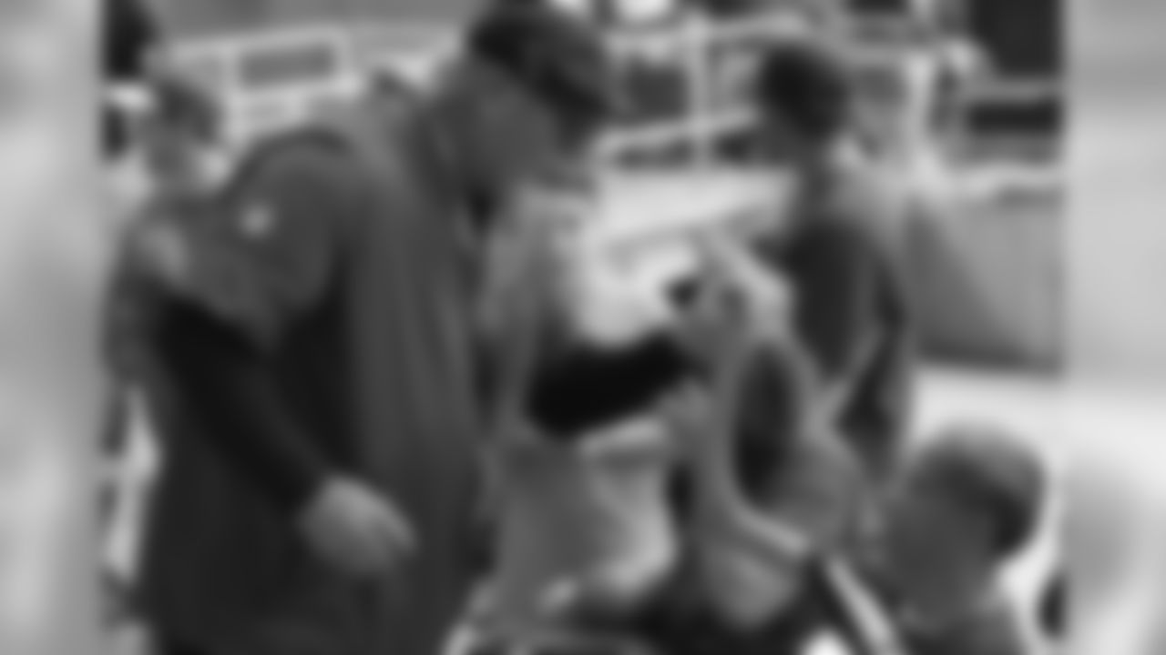 Coach Bruce Arians with a fan after practice