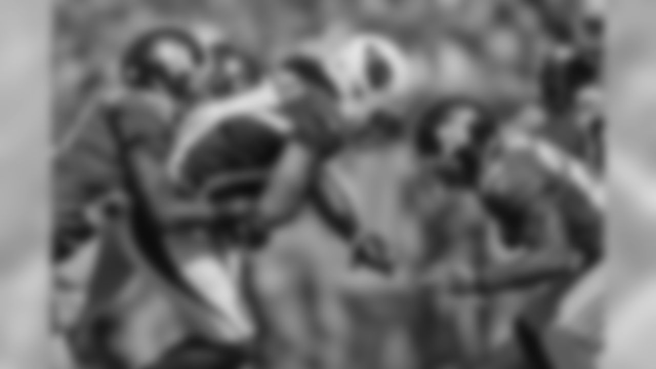 2014: WR Larry Fitzgerald fights for yardage